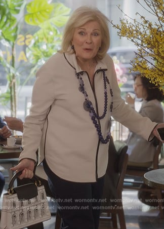 Enid’s white printed bag on And Just Like That