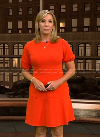 Jacqui Jeras’s red puff sleeve flare dress on CBS Evening News