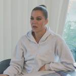 Khloe’s light gray hoodie and sweatpants on The Kardashians