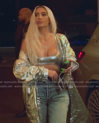 Kim's silver metallic swimsuit and coat on The Kardashians