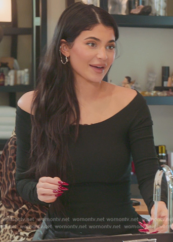 Kylie's black leather skirt and distressed top on The Kardashians