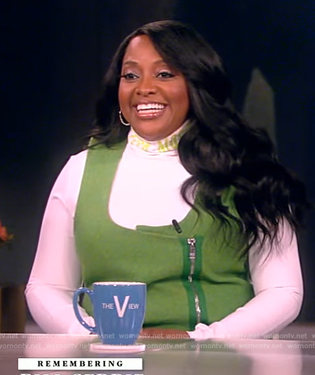 Sherri Shepard's white turtleneck top and green dress on The View