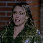 Sophie’s olive green plaid rain coat on How I Met Your Father