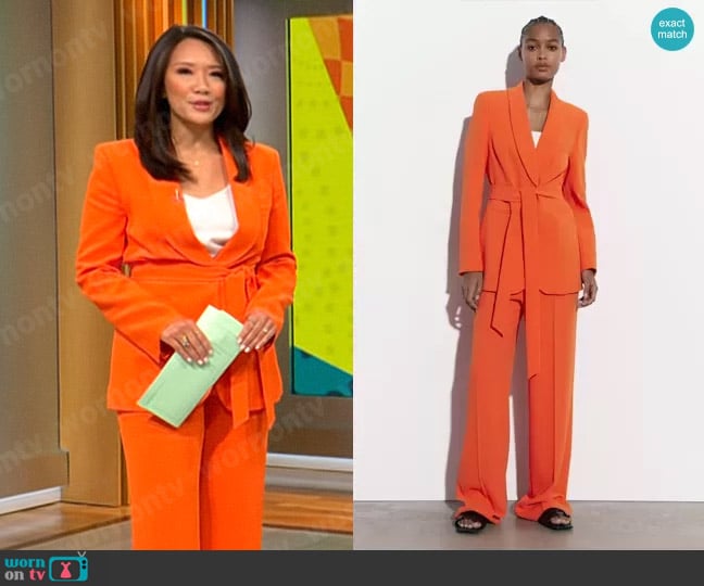 Zara Belted Tuxedo Collar Blazer in Orange worn by Nancy Chen on CBS Mornings