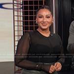 Adrienne’s black mesh knit top on E! News