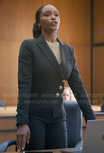 Andrea's black asymmetric blazer with gold buttons on The Lincoln Lawyer