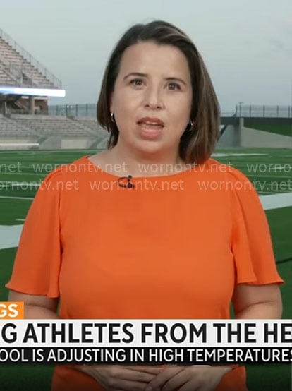 Andrea Lucia's orange top on CBS Mornings