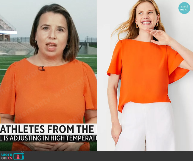 Ann Taylor Mixed Media Angel Sleeve Top in Summer Orange worn by Andrea Lucia on CBS Mornings