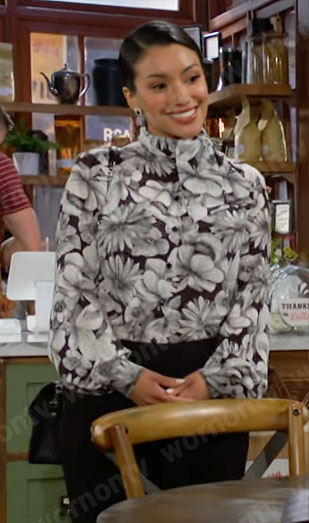Audra's black and white floral blouse on The Young and the Restless