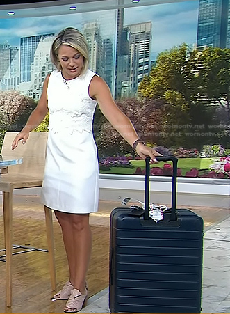 Dylan’s white floral lace dress and navy luggage on Today
