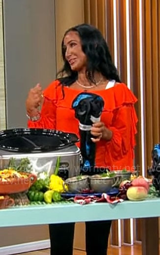 Elizabeth Werner's orange ruffled off-shoulder top on CBS Mornings