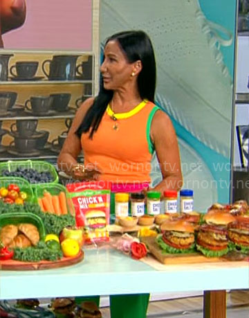 Elizabeth Werner’s orange knit top on CBS Mornings