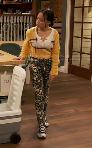 Ivy's yellow sweater and floral print pants on Ravens Home