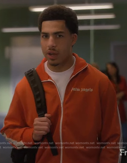 Junior's orange track jacket and pants on Grown-ish