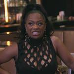 Kandi’s black fishnet crop top and skirt on The Real Housewives of Atlanta