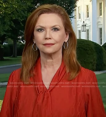 Kelly O’Donnell’s red chain print tie neck blouse on Today