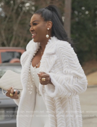 Kenya's white fur trench coat on The Real Housewives of Atlanta