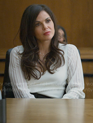 Lisa’s white v-neck top with sheer striped sleeves on The Lincoln Lawyer