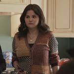 Mabel’s mixed plaid cardigan and leather skirt on Only Murders in the Building