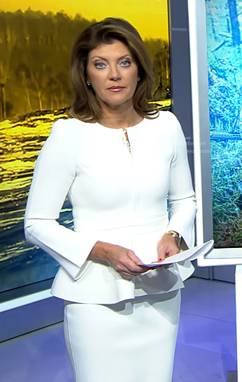 Norah's white peplum jacket and skirt on CBS Evening News