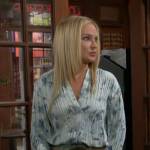 Sharon’s blue floral pleated blouse and green leather mini skirt on The Young and the Restless