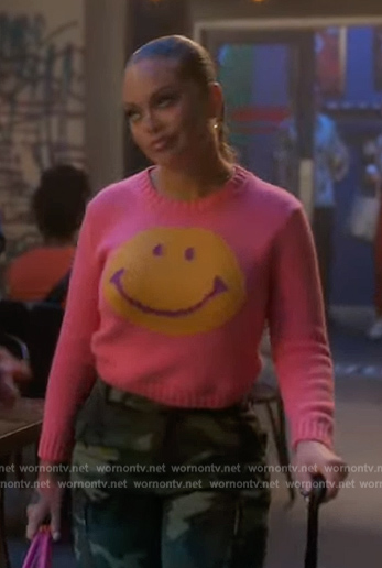 Sloane's pink smiley face sweater on Grown-ish
