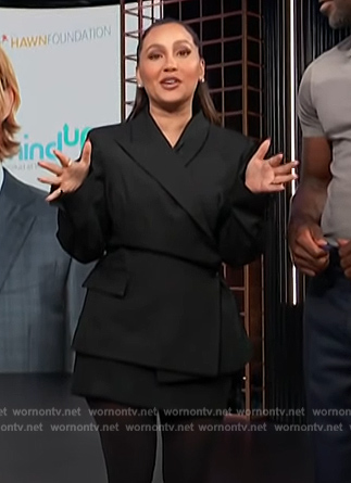 Adrienne’s black blazer and mini skirt on E! News