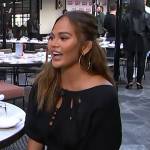 Chrissy Teigan’s black eyelet top on E! News