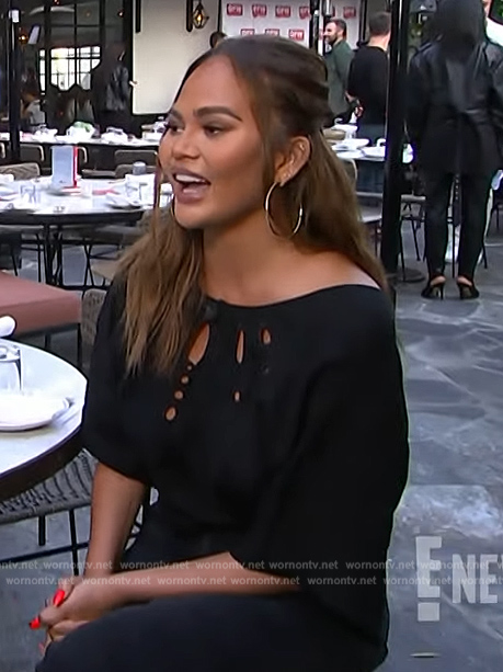 Chrissy Teigan's black eyelet top on E! News