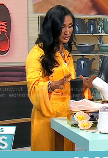Elizabeth Werner's orange draped wrap dress on CBS Mornings