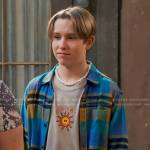 Jake’s beige sun print tee and blue plaid shirt on Bunkd