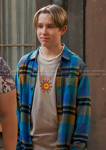 Jake's beige sun print tee and blue plaid shirt on Bunkd