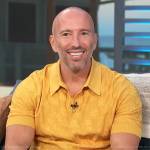 Jason Oppenheim’s yellow polo on Access Hollywood