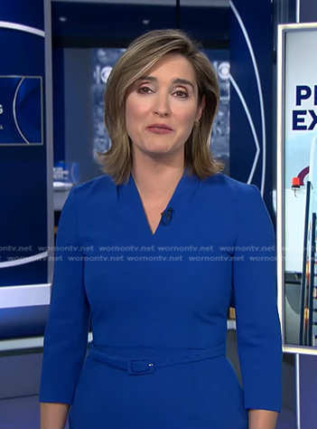 Margaret's blue v-neck belted dress on CBS Evening News