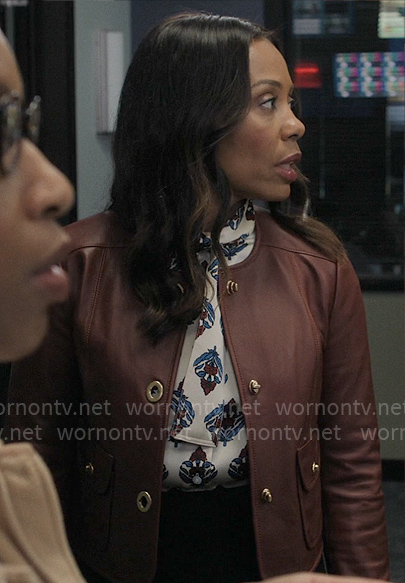 Mia's printed blouse and burgundy leather jacket on The Morning Show