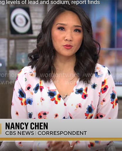 Nancy Chen’s white floral wrap blouse on CBS Saturday Morning