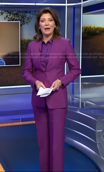 Norah's purple tie neck blouse and suit on CBS Evening News