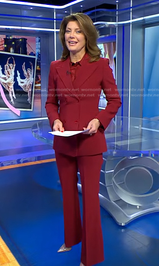 Norah’s red double breasted blazer and pants on CBS Evening News