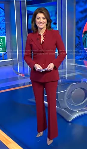 Norah’s red double breasted blazer and pants on CBS Evening News