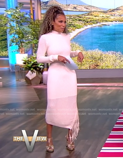 Sunny’s white crochet knit fringe dress on The View