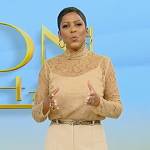 Tamron’s beige lace turtleneck top on Tamron Hall Show