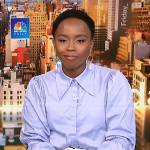 Zinhle’s blue bell sleeve shirt and white tie waist skirt on NBC News Daily