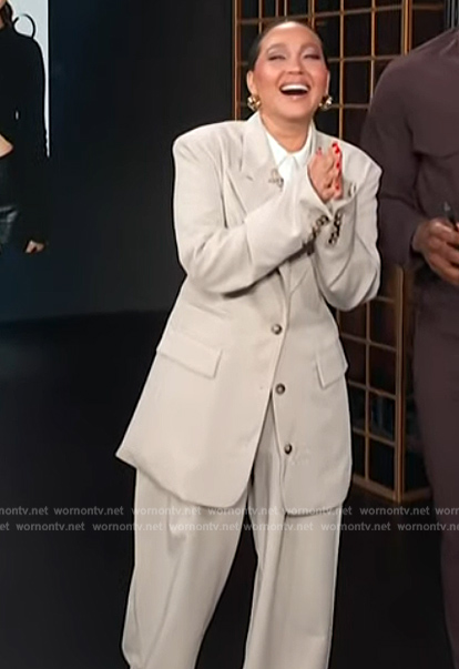 Adrienne’s beige oversized blazer on E! News