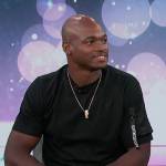 Adrian Peterson’s black sleeve pocket tee on Access Hollywood