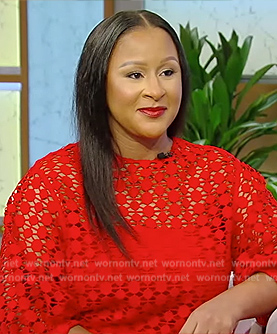 Angela Benton's red guipure lace top on Tamron Hall Show
