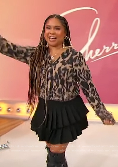 Angela Yee’s leopard print cardigan and mini skirt on Sherri