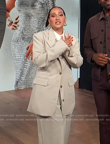 Adrienne’s beige oversized blazer on E! News