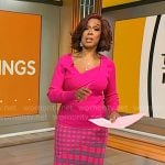 Gayle King’s pink asymmetric sweater and checked skirt on CBS Mornings