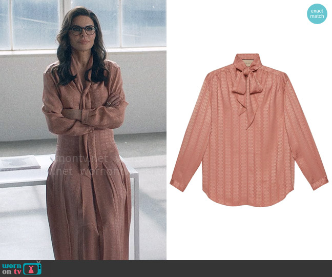 Sheila’s pink tie neck blouse on American Horror Stories