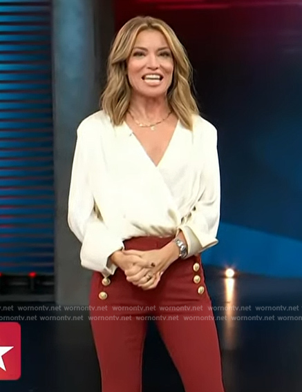 Kit’s white wrap blouse and red pants on Access Hollywood